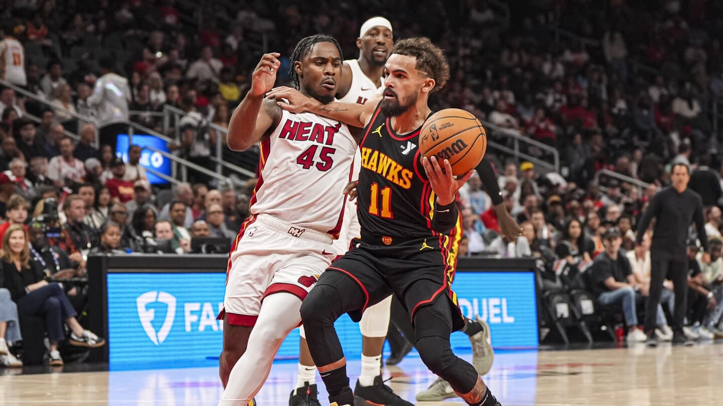 "Herro's Heroics and Mitchell's Magic: Heat Snag No. 8 Seed in Nail-Biting Finish Against Hawks"