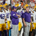 Unexpected Collision: LSU Coach Brian Kelly Knocked Down by Sideline Referee in Stunning Moment
