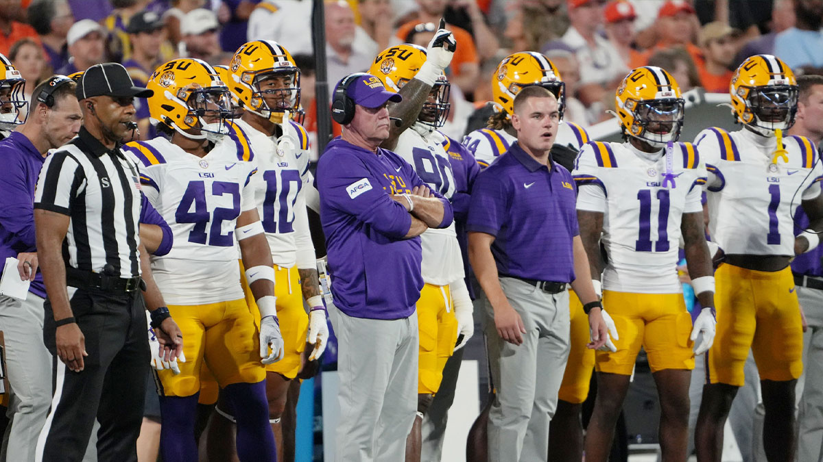 Unexpected Collision: LSU Coach Brian Kelly Knocked Down by Sideline Referee in Stunning Moment