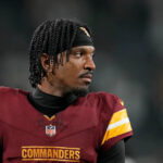 Jayden Daniels Battles Knee Injury in Practice, but Is He Ready to Face the Falcons?