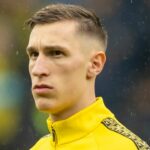 Bidding War Erupts Between Manchester United and Liverpool for Dortmund's Star Defender Nico Schlotterbeck Amid Contract Standoff