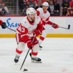 Detroit Red Wings Face Pivotal Moment: GM Search Heats Up as DeBrincat and Edvinsson's Futures Hang in the Balance